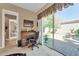 Home office with desk, chair, and backyard access at 37181 N 103Rd St, Scottsdale, AZ 85262