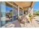 Covered patio with seating area, sliding glass doors, and views of the backyard at 37181 N 103Rd St, Scottsdale, AZ 85262