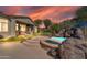 Relaxing patio with fire pit and built-in seating at 37181 N 103Rd St, Scottsdale, AZ 85262