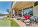 Outdoor patio with seating and dining areas near the pool at 37181 N 103Rd St, Scottsdale, AZ 85262