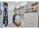 Large walk-in closet with ample shelving and hanging space at 37181 N 103Rd St, Scottsdale, AZ 85262