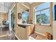 Home wet bar with granite countertop and built-in appliances at 37181 N 103Rd St, Scottsdale, AZ 85262