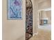 Elegant wine cellar with wrought iron door and extensive wine storage at 37181 N 103Rd St, Scottsdale, AZ 85262