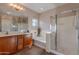 Bathroom boasts double sinks, soaking tub, and walk-in shower at 40950 W Bedford Dr, Maricopa, AZ 85138