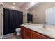 Clean bathroom with single sink vanity and shower/tub combo at 40950 W Bedford Dr, Maricopa, AZ 85138