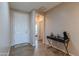 Bright and spacious entryway with tile floors and a console table at 40950 W Bedford Dr, Maricopa, AZ 85138