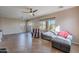 Spacious living area featuring tile floors, comfy seating, and lots of natural light at 40950 W Bedford Dr, Maricopa, AZ 85138