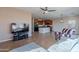 Living room with open concept view to kitchen at 40950 W Bedford Dr, Maricopa, AZ 85138