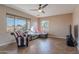 Living room features comfy seating and a large window at 40950 W Bedford Dr, Maricopa, AZ 85138