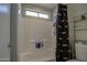 Clean bathroom with shower/tub combo and storage at 4608 W Maryland Ave # 127, Glendale, AZ 85301