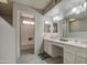 Bright bathroom with double vanity, shower, and tile floors at 4608 W Maryland Ave # 127, Glendale, AZ 85301