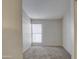 Bright bedroom featuring a window with blinds and carpet at 4608 W Maryland Ave # 127, Glendale, AZ 85301