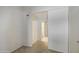 Simple bedroom with carpet, a closet and access to a hallway at 4608 W Maryland Ave # 127, Glendale, AZ 85301