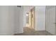 A bedroom with carpet flooring and access to another bedroom at 4608 W Maryland Ave # 127, Glendale, AZ 85301