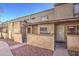 Tan stucco condo building with walkway and small front yards at 4608 W Maryland Ave # 127, Glendale, AZ 85301