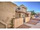 Tan stucco condo building with walkway and small front yards at 4608 W Maryland Ave # 127, Glendale, AZ 85301