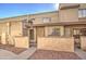 Tan stucco condo building with walkway and small front yards at 4608 W Maryland Ave # 127, Glendale, AZ 85301