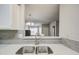 Clean kitchen sink with a view into the living room at 4608 W Maryland Ave # 127, Glendale, AZ 85301