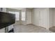 Living room with tile floors, a brown leather couch and a flat screen TV at 4608 W Maryland Ave # 127, Glendale, AZ 85301