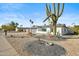 Updated landscaping featuring a large saguaro cactus at 4942 E Wethersfield Rd, Scottsdale, AZ 85254