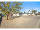 Modern desert landscape with gravel and drought-tolerant plants at 4942 E Wethersfield Rd, Scottsdale, AZ 85254