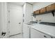 Bright laundry room with washer, dryer, and ample storage at 4942 E Wethersfield Rd, Scottsdale, AZ 85254