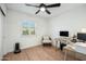 Home office featuring wood desk and window shutters at 4942 E Wethersfield Rd, Scottsdale, AZ 85254