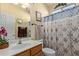 Clean bathroom with shower/tub combo and wood vanity at 5126 S Sugarberry Ct, Gilbert, AZ 85298