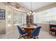 Bright breakfast nook with wood table and chairs at 5126 S Sugarberry Ct, Gilbert, AZ 85298