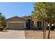 One-story house with a two-car garage and desert landscaping at 5126 S Sugarberry Ct, Gilbert, AZ 85298