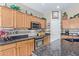 Bright kitchen, featuring stainless steel appliances and oak cabinets at 5126 S Sugarberry Ct, Gilbert, AZ 85298