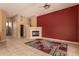 Relax by the fireplace in the large living room with views to the backyard and access to other spaces at 5126 S Sugarberry Ct, Gilbert, AZ 85298