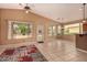 Bright and airy living room offers backyard views and convenient access to the updated kitchen at 5126 S Sugarberry Ct, Gilbert, AZ 85298