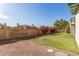 Spacious backyard with grassy area and block wall at 525 E Glencove St, Mesa, AZ 85203