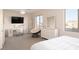 Bright bedroom with mountain views, a vanity, a papasan chair, and neutral carpet at 5528 E Windstone Trl, Cave Creek, AZ 85331