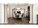 Elegant dining room featuring decorative columns, chandelier, and seating for six at 5528 E Windstone Trl, Cave Creek, AZ 85331
