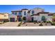 Stunning two-story home featuring a well-manicured yard, elegant architecture, and a welcoming entrance at 5528 E Windstone Trl, Cave Creek, AZ 85331
