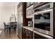 Modern kitchen features stainless steel appliances and dark wood cabinetry, creating a warm and inviting space at 5528 E Windstone Trl, Cave Creek, AZ 85331