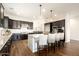An open kitchen boasts a large island, stainless steel appliances, and custom cabinetry at 5528 E Windstone Trl, Cave Creek, AZ 85331