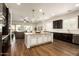 Bright open-concept kitchen with an island, stainless steel appliances, and wood floors at 5528 E Windstone Trl, Cave Creek, AZ 85331