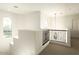 Bright landing with elegant railing, offering a transition space with natural light and architectural detail at 5528 E Windstone Trl, Cave Creek, AZ 85331