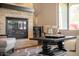 Close up view of the beautiful stone fireplace in the bright and airy living room space at 5528 E Windstone Trl, Cave Creek, AZ 85331