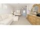 Spacious main bedroom with a white sectional sofa, four poster bed, and view of the outdoor terrace at 5528 E Windstone Trl, Cave Creek, AZ 85331