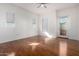 Bedroom with hardwood floors and access to balcony at 615 E Portland St # 112, Phoenix, AZ 85004