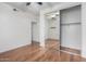 Bedroom with mirrored closet and ceiling fan at 615 E Portland St # 112, Phoenix, AZ 85004