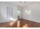 Bright bedroom with hardwood floors and private balcony at 615 E Portland St # 112, Phoenix, AZ 85004