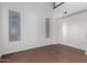Bright bedroom with large window and neutral walls at 615 E Portland St # 112, Phoenix, AZ 85004