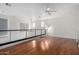 Bright loft with hardwood floors and modern railing at 615 E Portland St # 112, Phoenix, AZ 85004