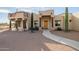 Exterior of a Southwestern-style home with a walkway and desert landscaping at 751 E Moon Vista St, Apache Junction, AZ 85119