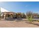 Exterior of a Southwestern-style home with a large front yard and desert landscaping at 751 E Moon Vista St, Apache Junction, AZ 85119